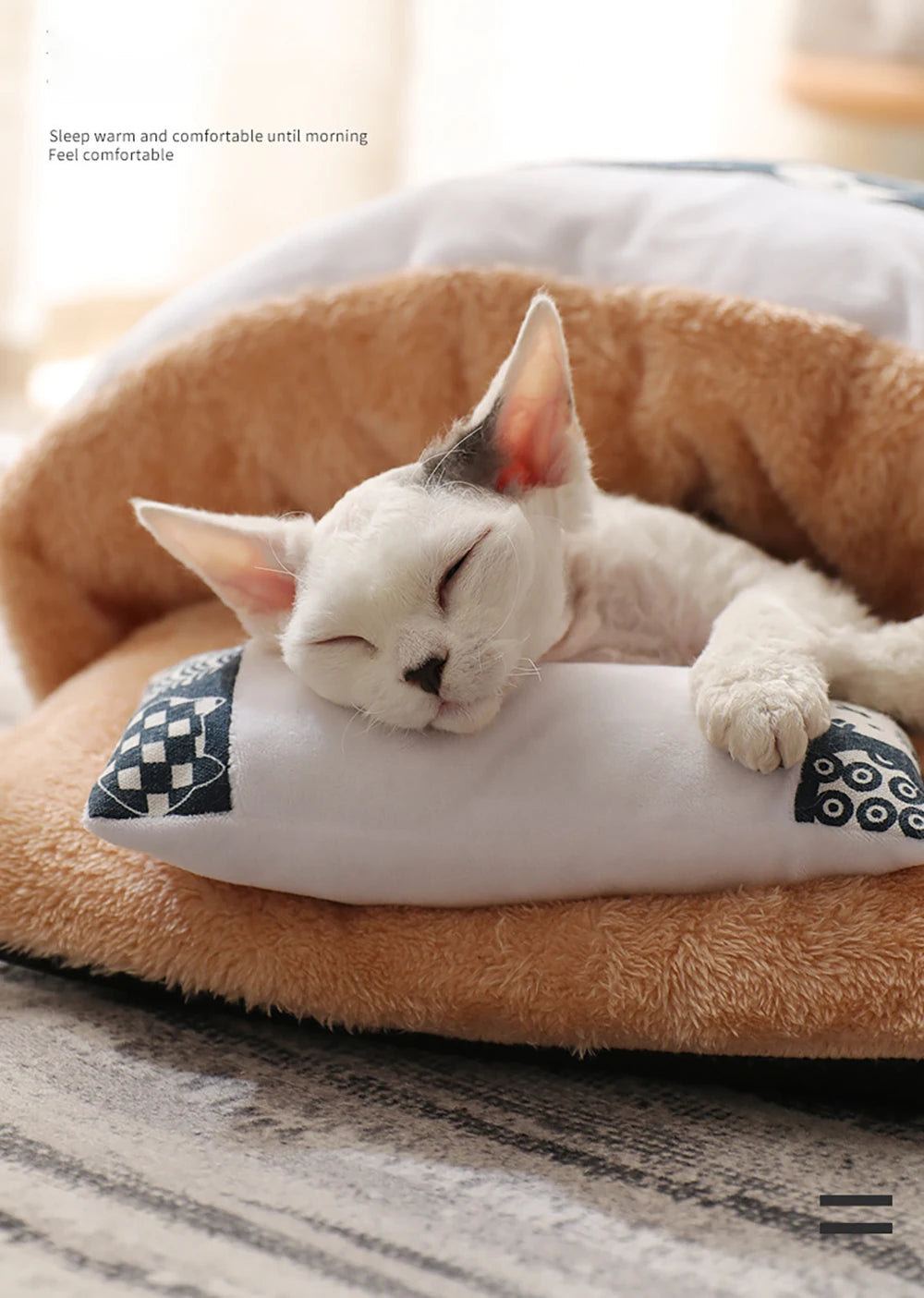 Cat asleep on the soft plush base of the pet sleeping bag